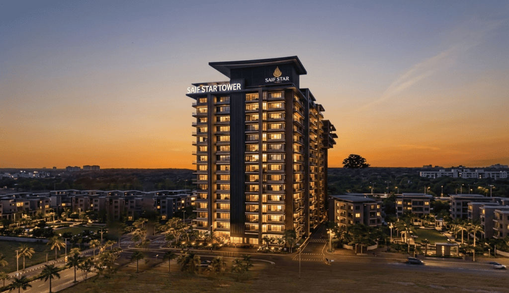 High-rise building at sunset with "Safe Start Tower" signage.